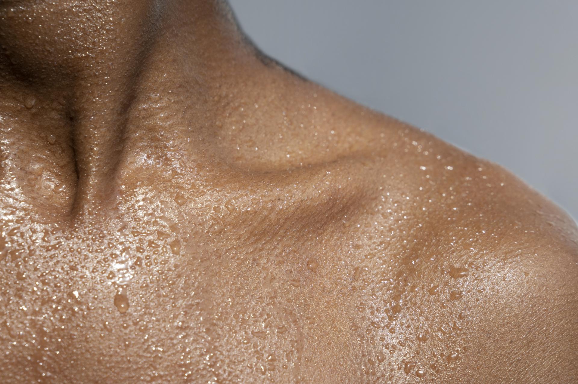 Close up woman body with moisturizer